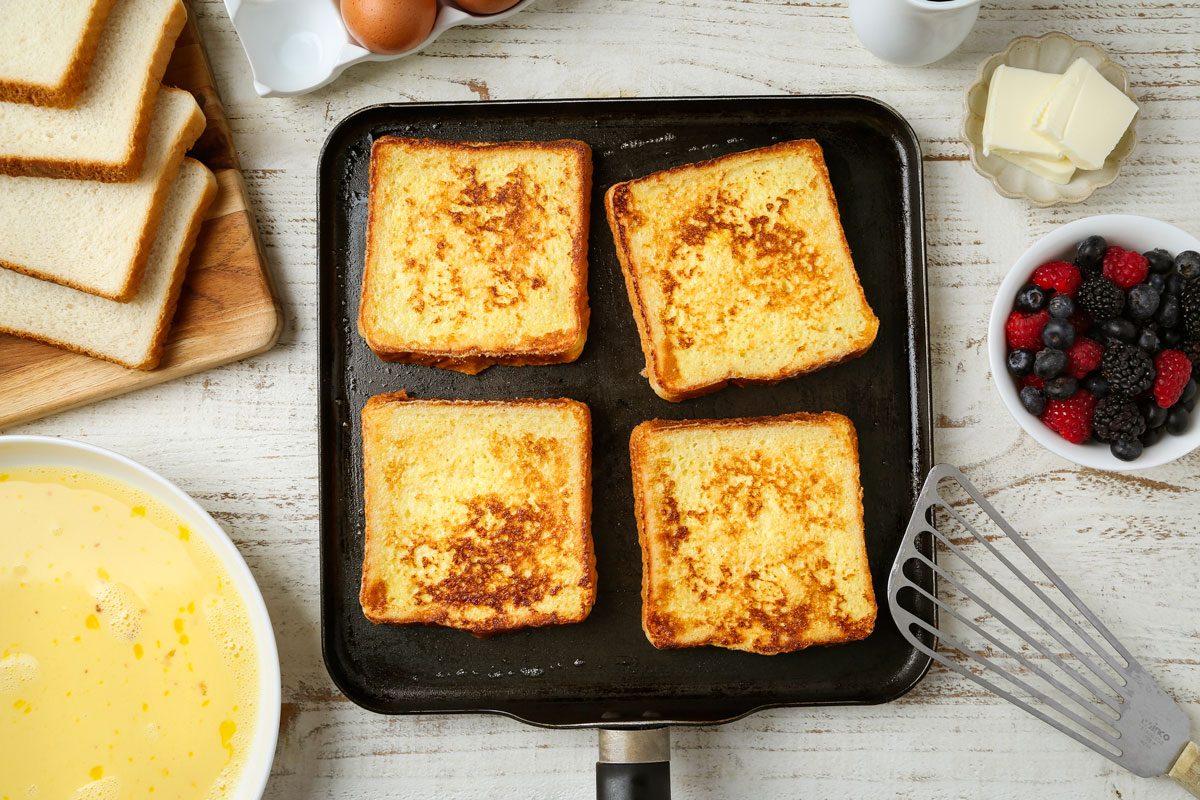 Dip bread into egg mixture allowing to soak 30 seconds on each side; Cook on griddle until golden brown on both sides