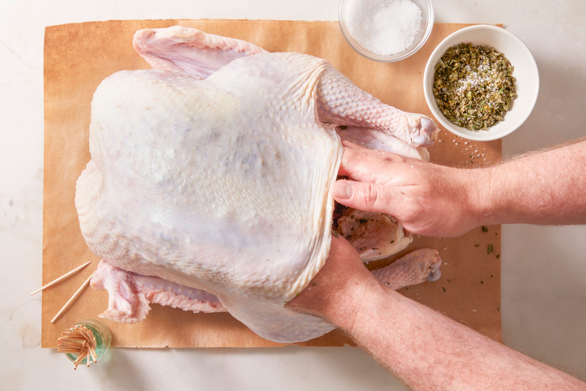 With fingers, carefully loosen skin from the turkey breast; rub herb mixture under the skin.