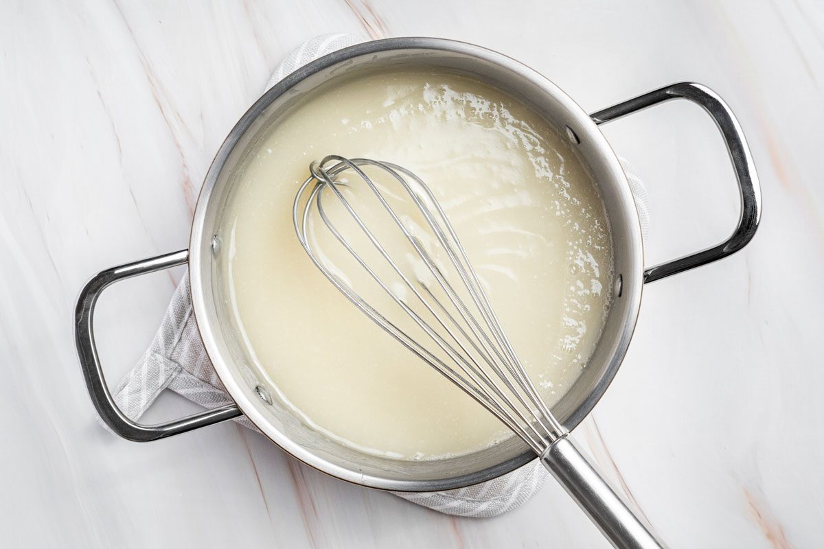Overhead shot of remove from heat and placed on a marble surface;