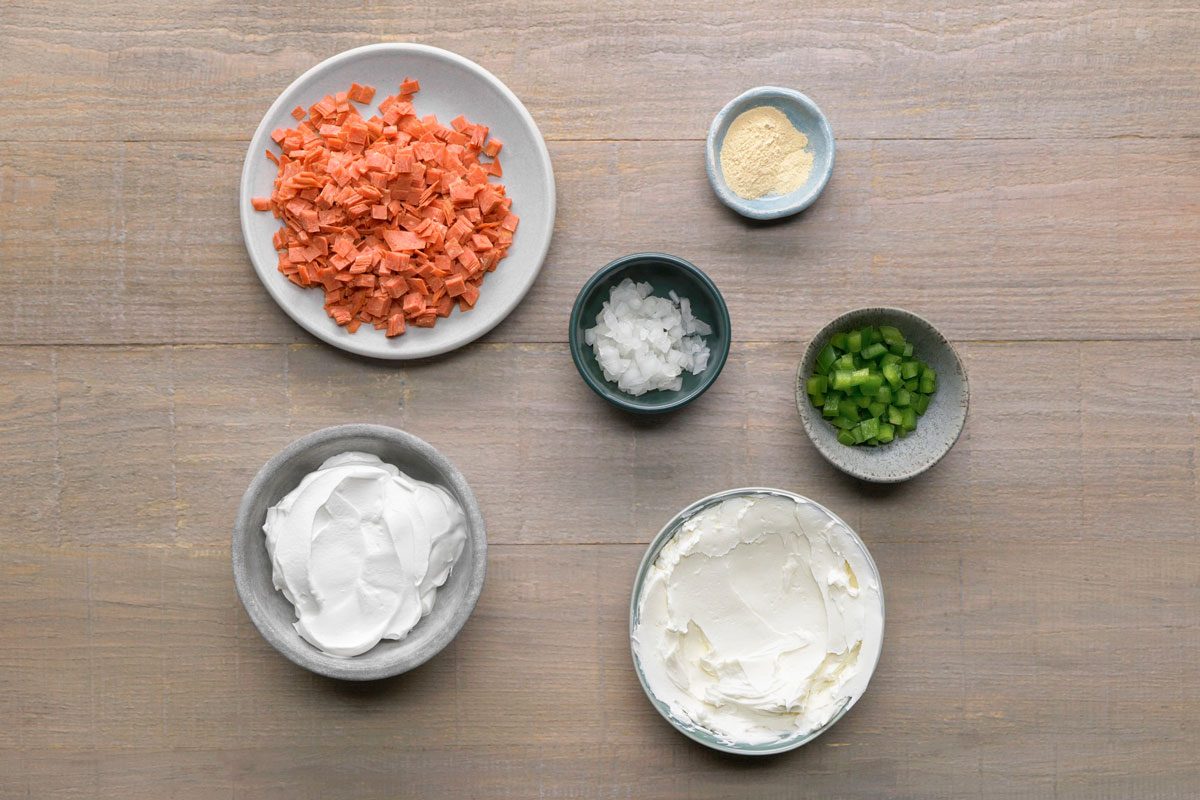 overhead shot of beef dip ingredients placed over wooden background