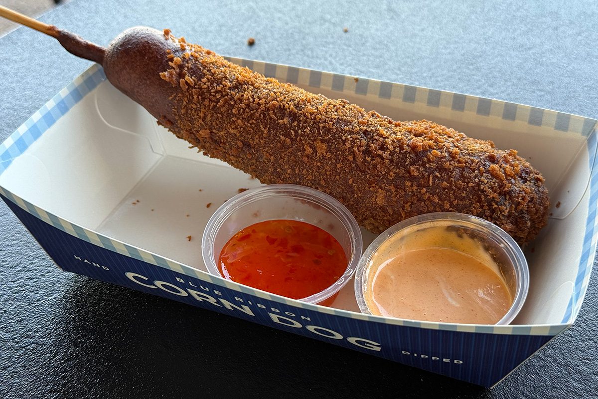 Disney Golden Dragon Corn Dog on a table