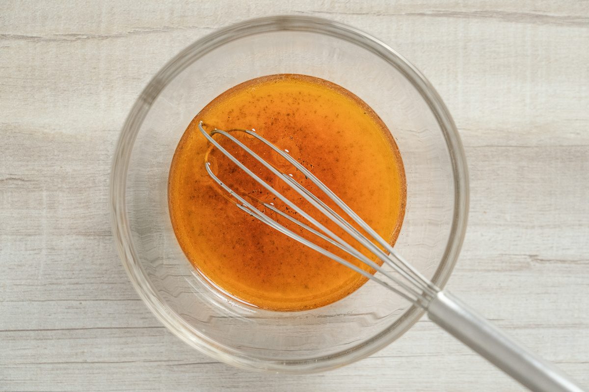 canola oil, sugar, tarragon vinegar, salt, hot pepper sauce and pepper mixed in a bowl
