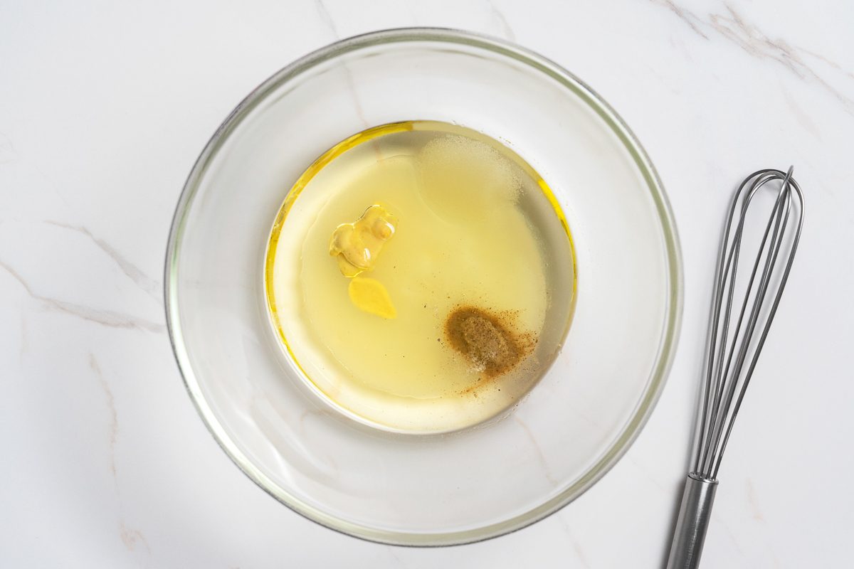 lemon juice, Dijon, sugar, salt and white pepper combined in a bowl