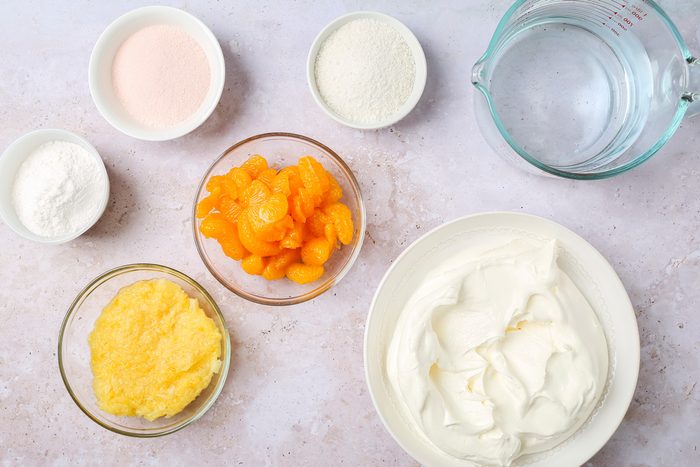 water, oranges, pudding mix, crushed pineapple, whipped topping and orange gelatin