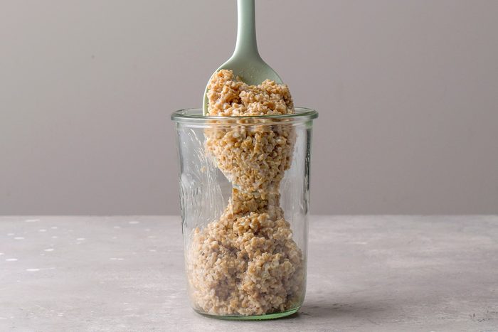 oats being transferred to a jar