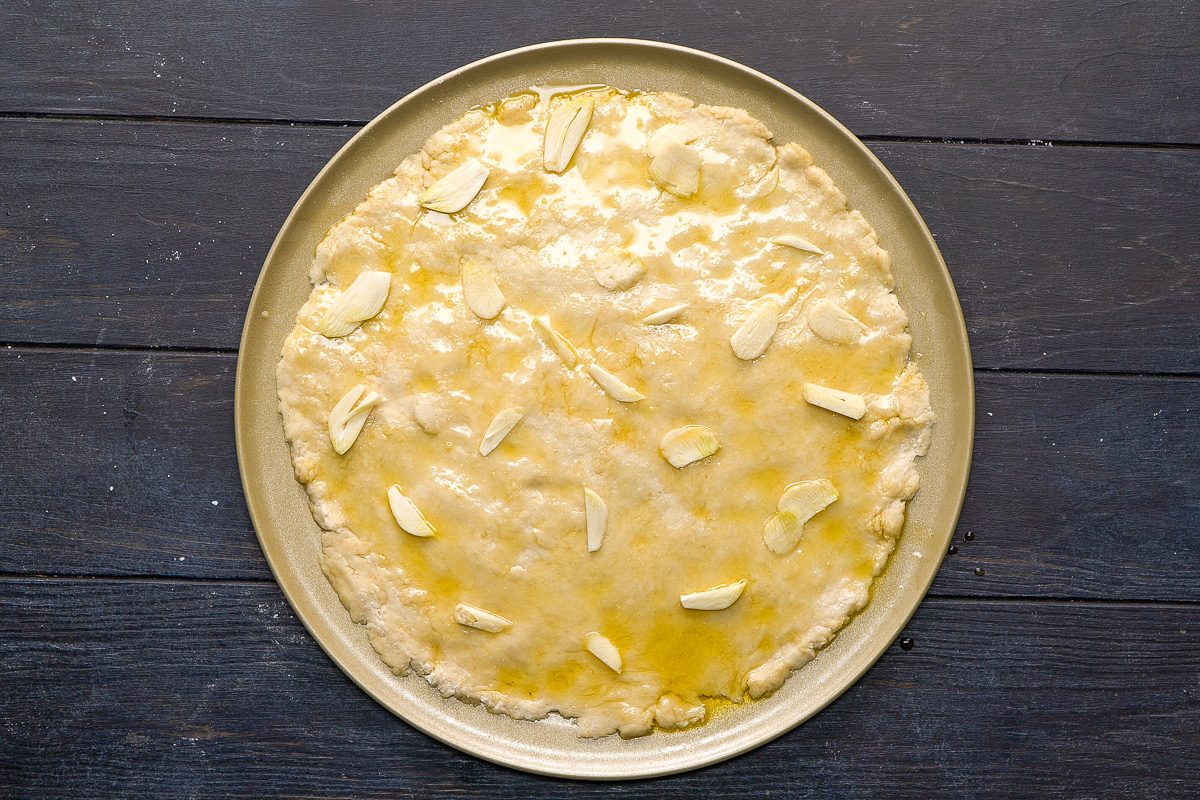 dough drizzled with olive oil and garlic