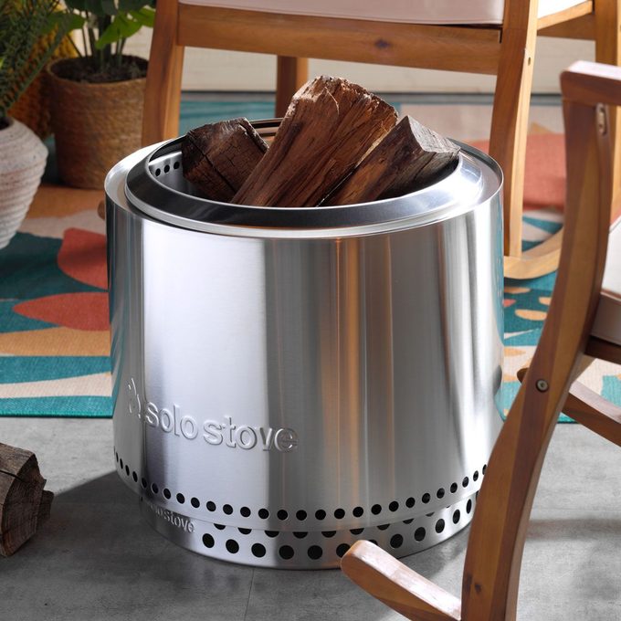 Solo Stove Patio Shot With Chairs And Firewood