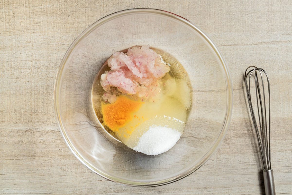 In a small bowl, whisk the oil, 1/4 cup sugar, vinegar, onion, mustard and salt until sugar is completely dissolved;