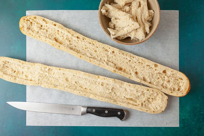 Baguette cutted in half horizontally by serrated knife