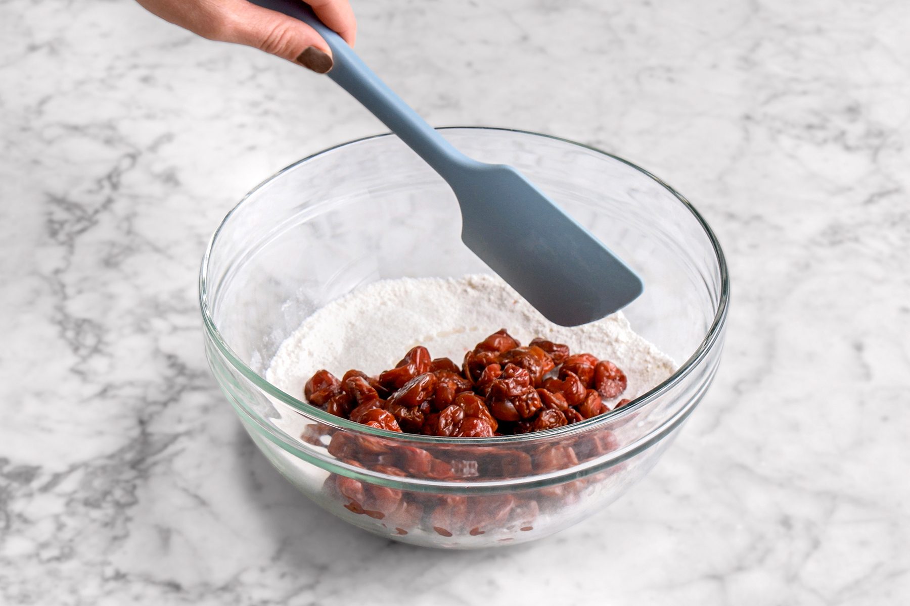 Prep the cherries in flour for Tart Cherry Pie