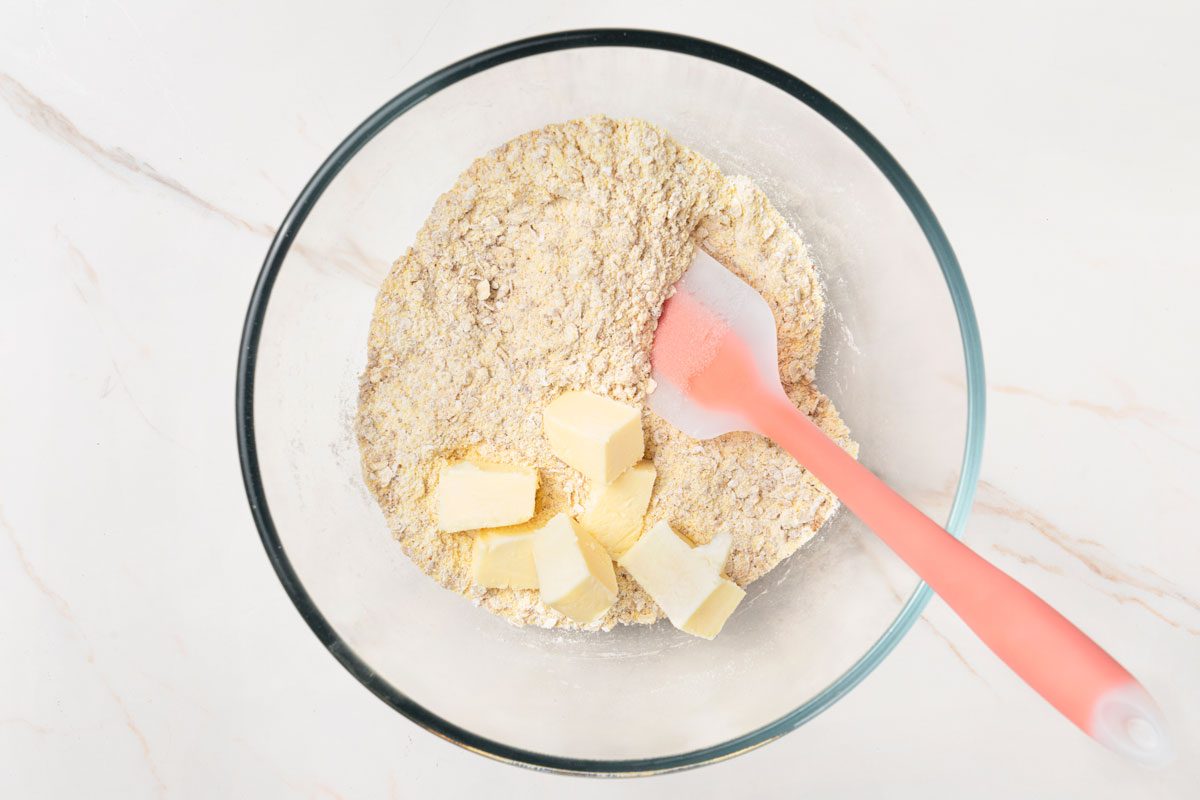 Cut in butter until crumbly.