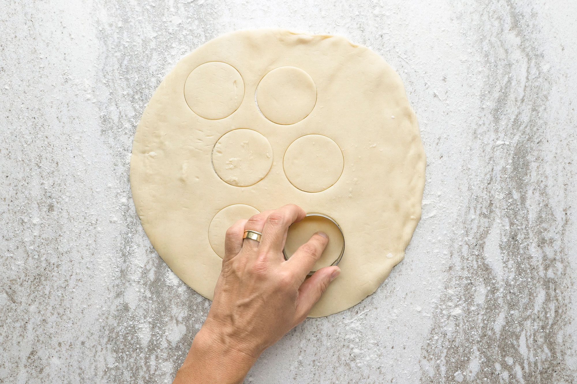 Cut out six 2 inches circles from remaining crust