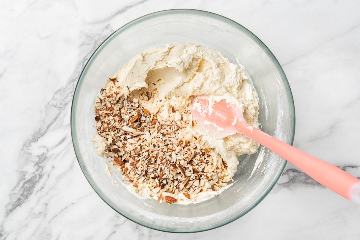 chopped almonds added to flour, butter and sugar mixture