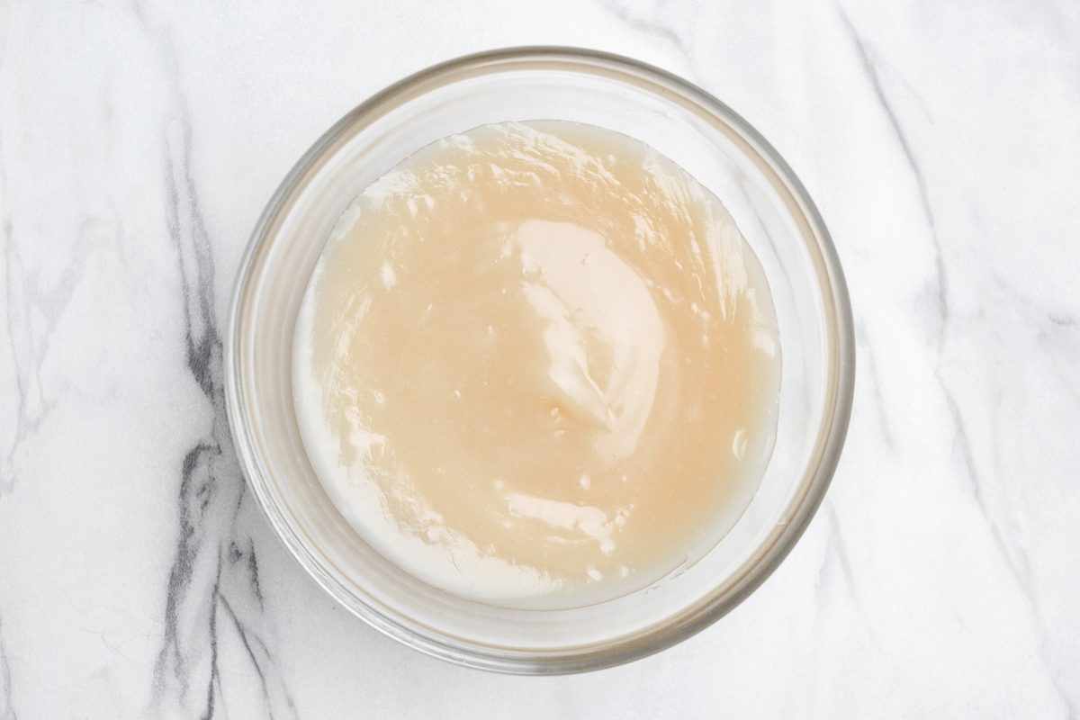 melted vanilla chips and oil mixture in a bowl