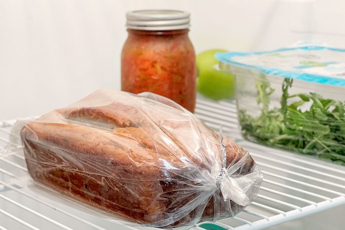 Whole bread packed in a plastic place in a refrigerator