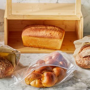 A whole bread on a wire rack