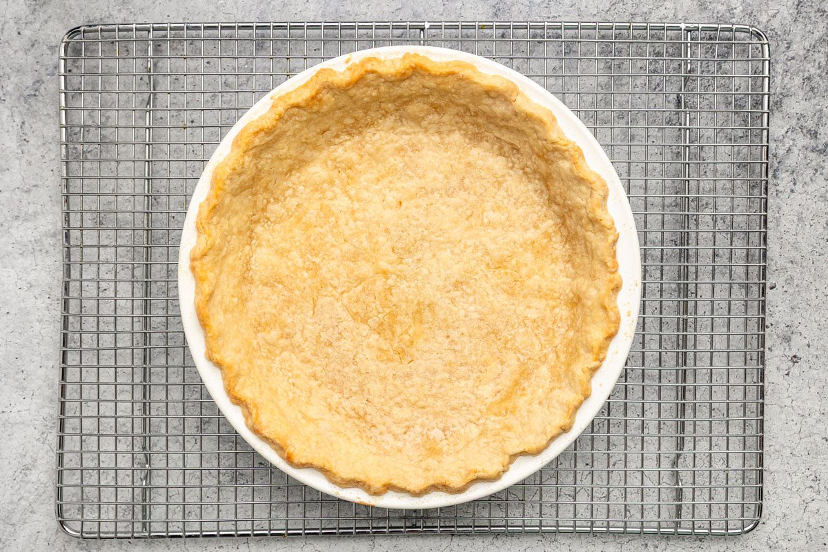 In a bowl beat the shortening and water until combined; Add flour and salt; beat until crumbly; Shape into a b all; Roll out pastry to fit a pie plate