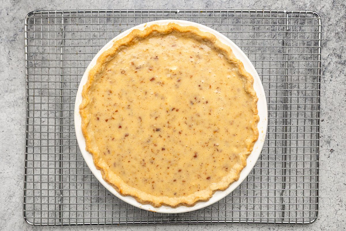 In another bowl cream the butter; sugar; flour and salt; Add the eggs; milk and vanilla; beat well; Stir in the pecans; Pour into prepared crust