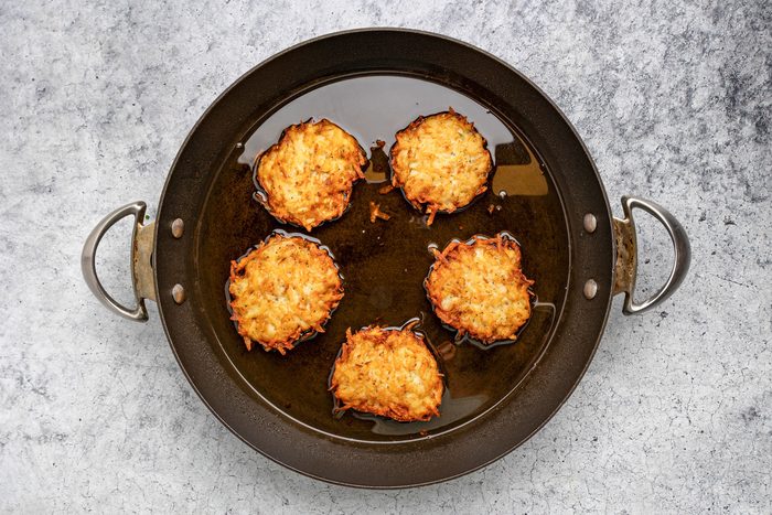 In a large skillet, heat 1/4 in. oil over medium heat. Drop batter by 1/4 cupfuls; press lightly to flatten.