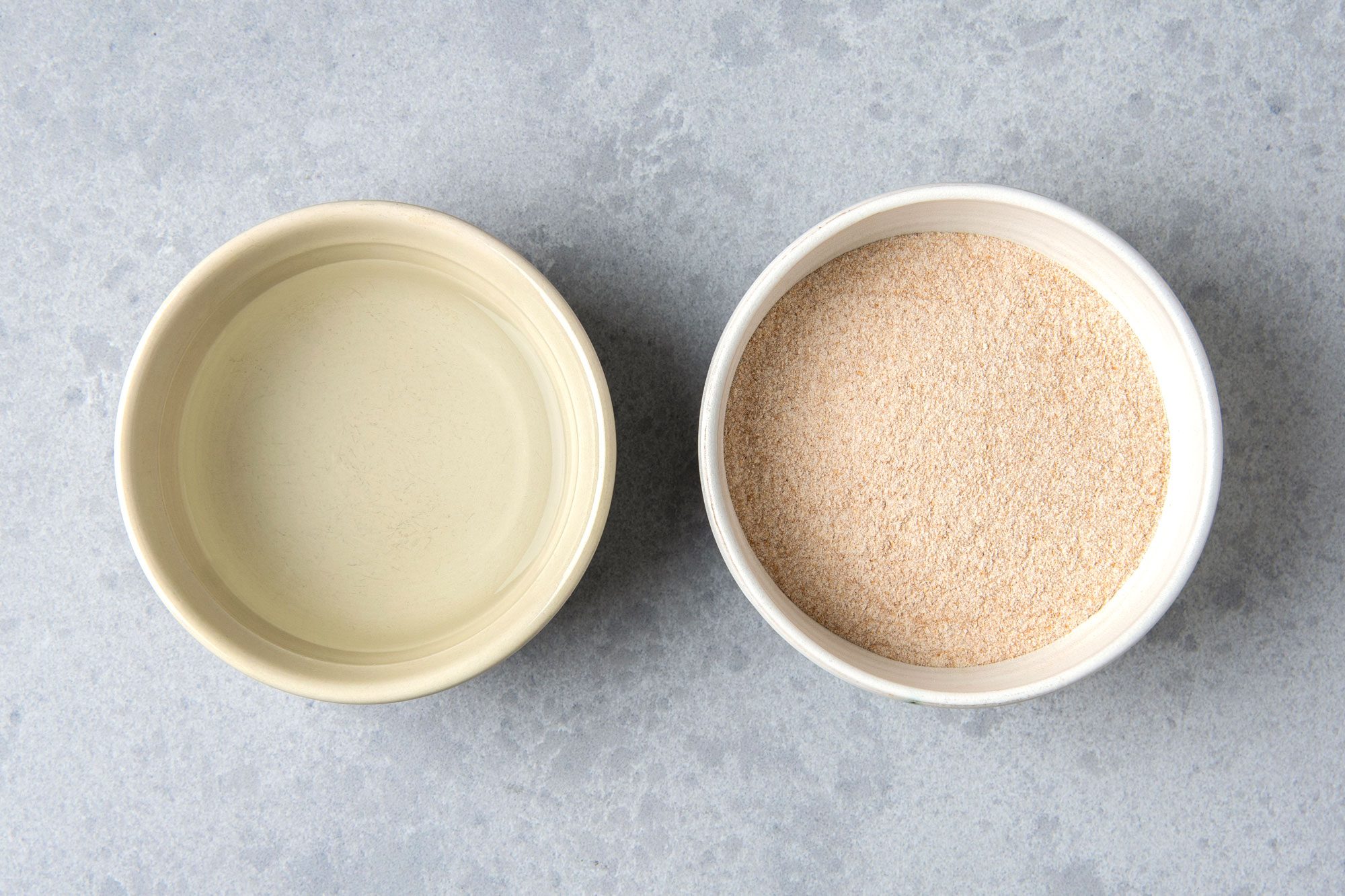 two bowls of wheat flour and water