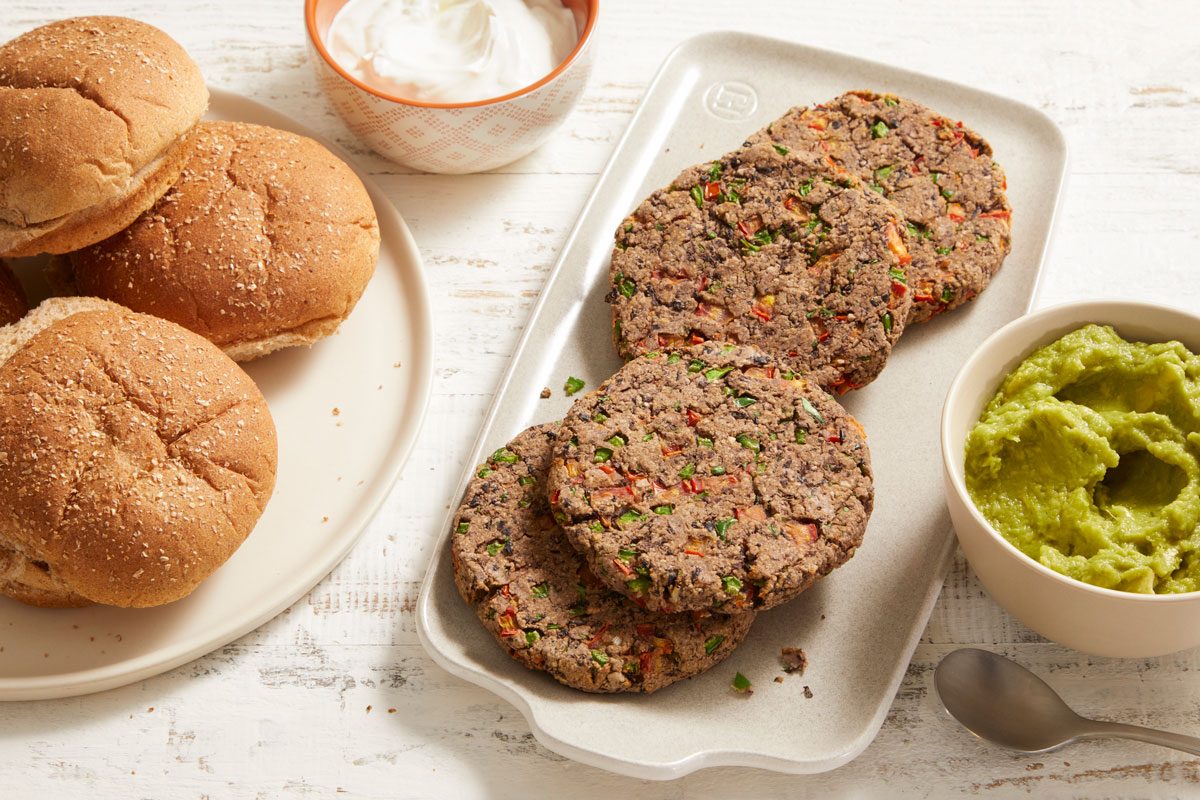 3/4 shot of Air-Fryer Salsa Black Bean Burgers served with sour cream