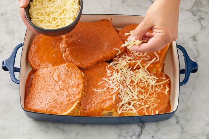 Overhead shot of sprinkle with the Italian cheese blend; all set on a marble surface;