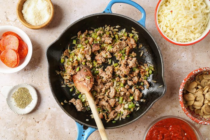 sausage and veggies cooked in a skillet