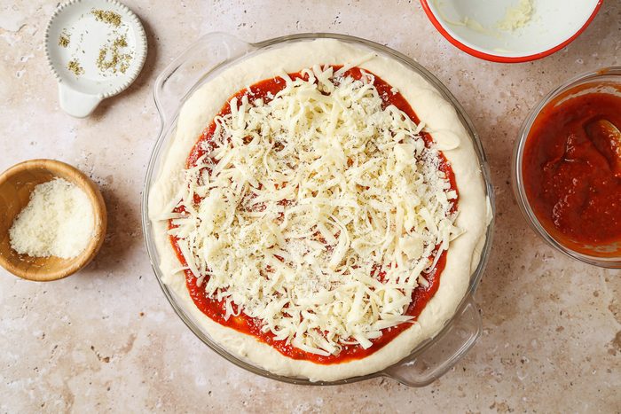 cheese sprinkled over pie crust