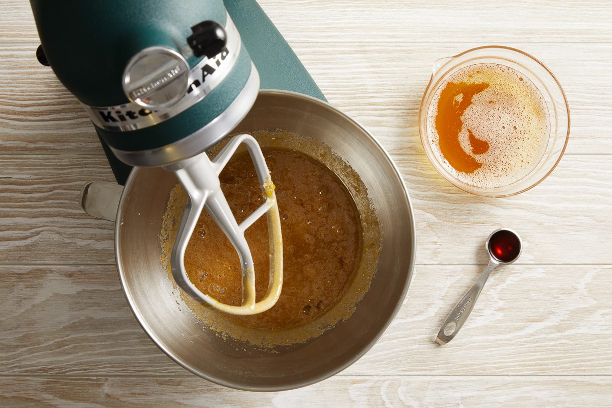 brown sugar, eggs and egg yolk being beaten together