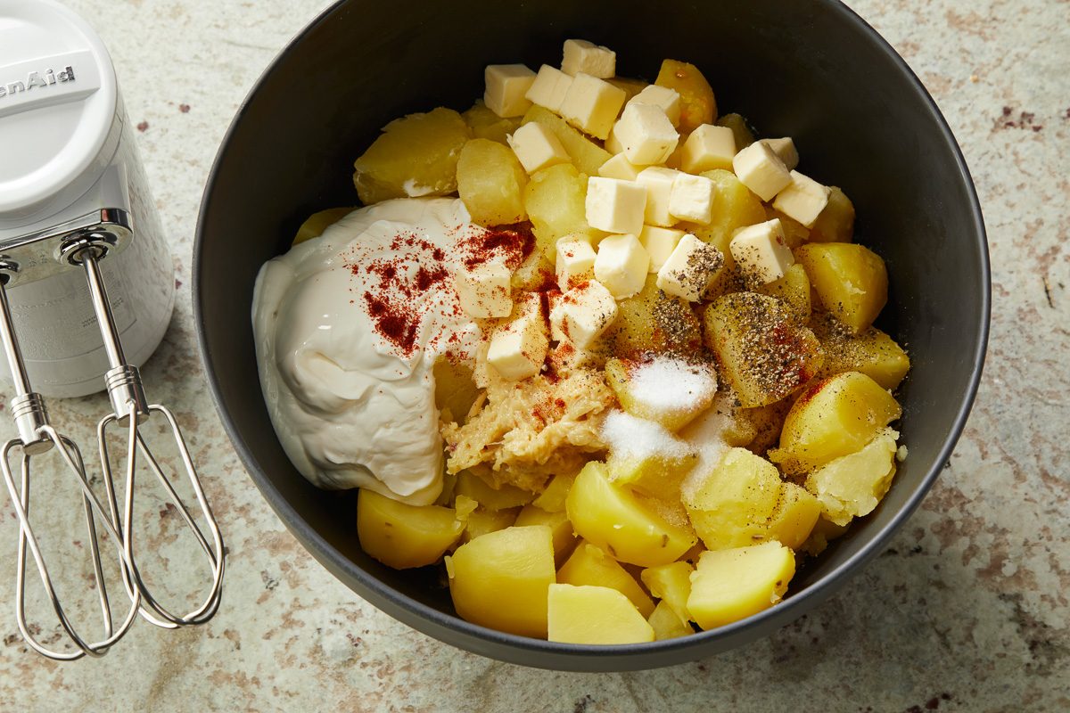butter, sour cream, smoked paprika, salt and pepper added to the potatoes