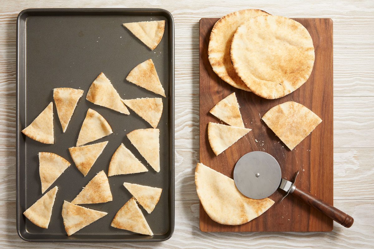 cut each pita bread into 8 wedges.
