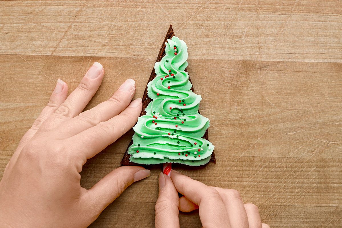 add a mini candy to make the trunk for a tree for Christmas Tree Brownies