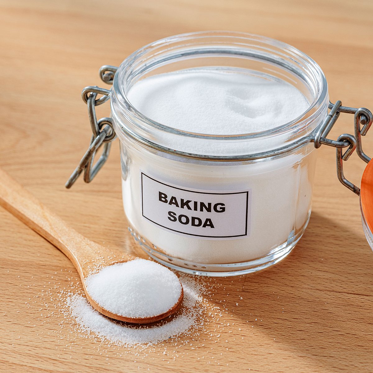 Baking soda in a glass jar and spoon