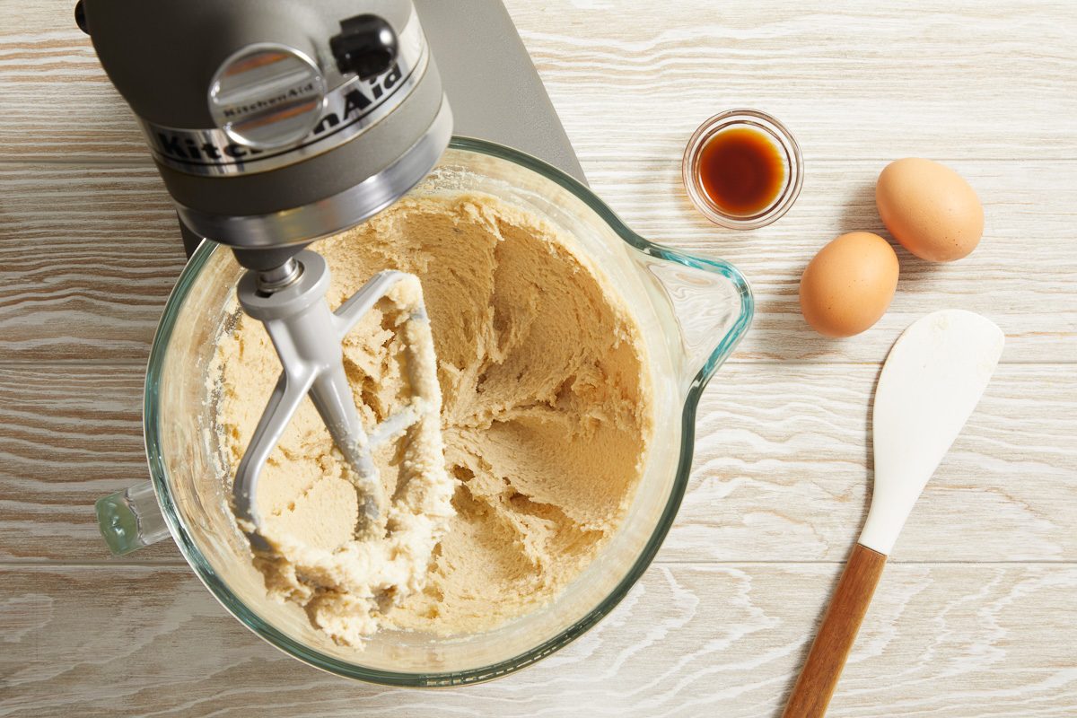 butter, shortening and sugar being mixed in a large bowl