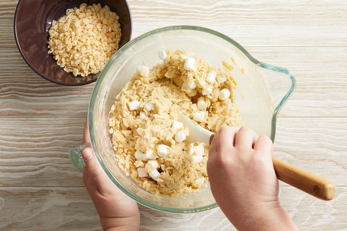 marshmallows being folded into cookie dough