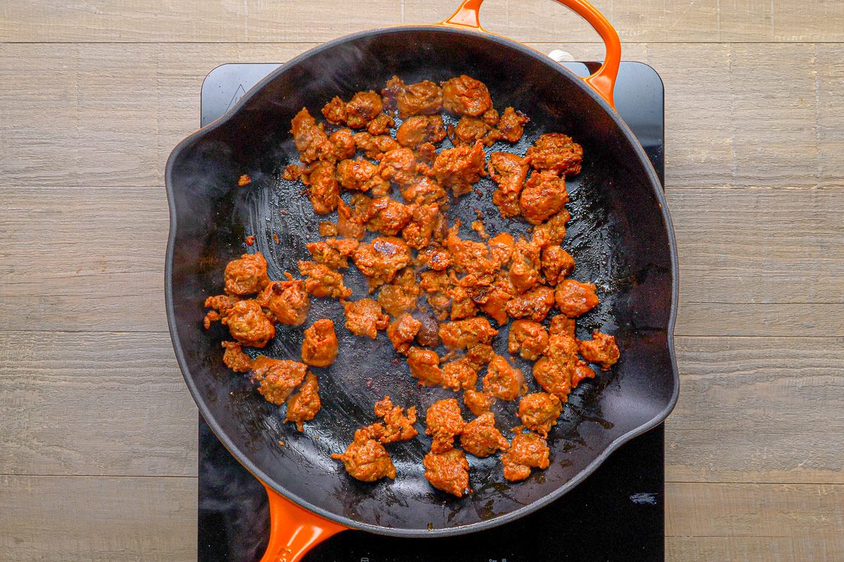 chorizo being cooked in a skillet