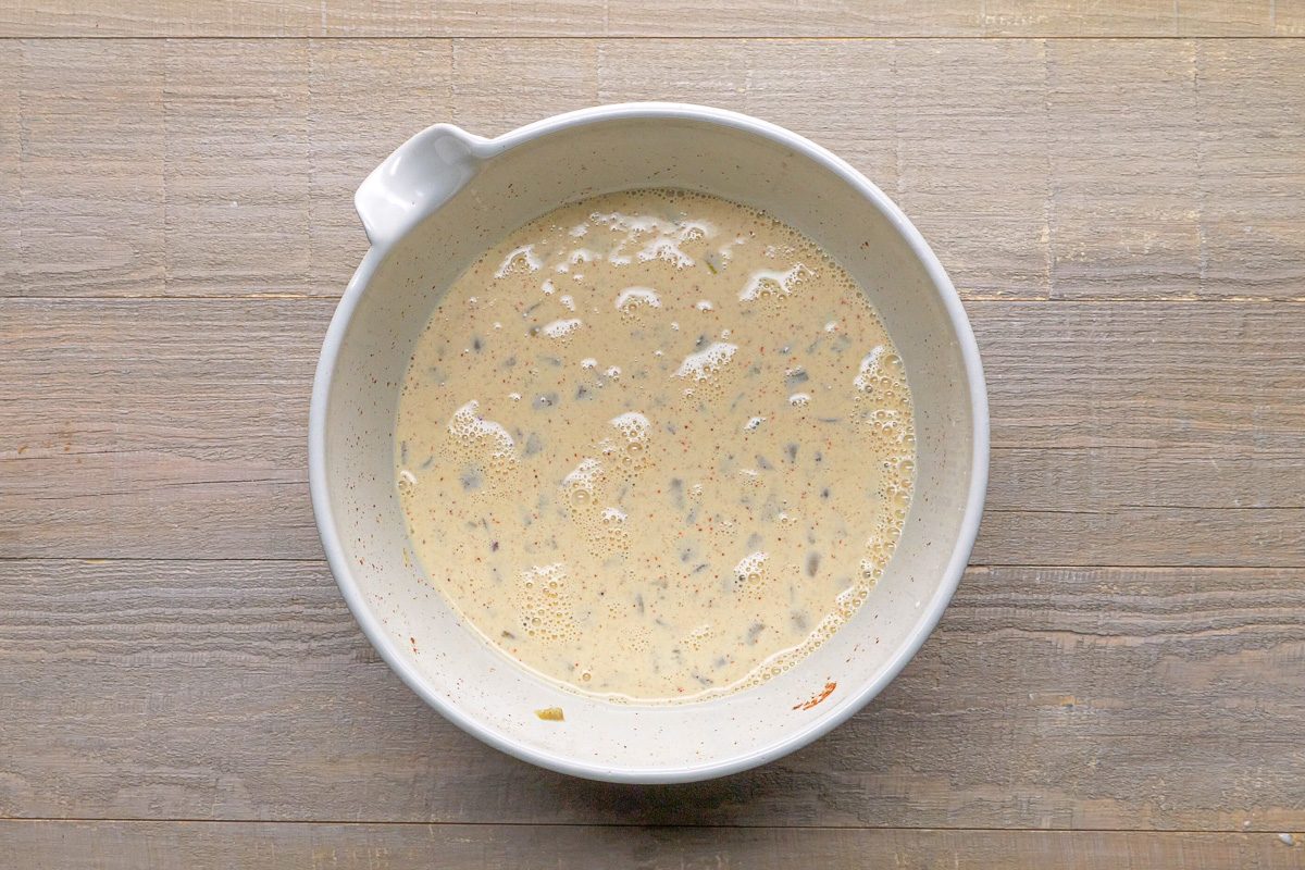 eggs, cream, green chiles and chili powder whisked together in a large bowl